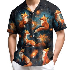 May include: Short-sleeved button-down shirt featuring a vibrant print of foxes set against a starry night sky. The foxes are depicted in shades of orange and white, with a dark blue and black background. The shirt has a classic collar and button closure.