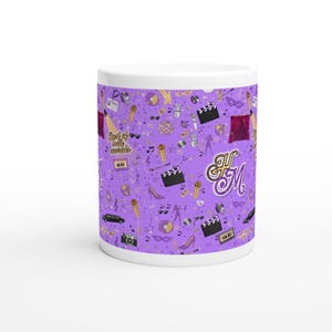 May include: White ceramic mug with a purple background featuring a pattern of musical and entertainment-themed icons. The design includes microphones, film clapperboards, high heels, and the text "Best of both worlds".