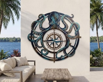 May include: A circular metal wall art piece featuring a central compass rose with cardinal directions N, S, E, and W. An octopus with long, curling tentacles wraps around the compass, finished in a weathered blue and bronze patina.