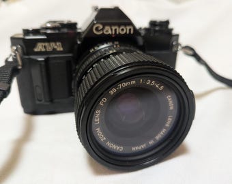 Canon AV-1 Vintage 35mm Film SLR Camera with Canon New FD 35-70mm F3.5-4.5 Tested Working Condition