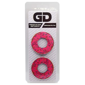 May include: Two pink donut-shaped grip donuts with sprinkles and brown icing, packaged in a clear plastic blister pack. The package has the text "GD" and "GRIPDONUTS.COM".