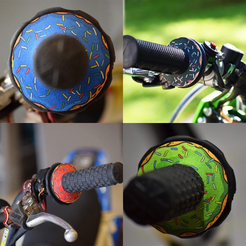 May include: Motorcycle handlebar grips with a unique donut design. The grips feature a blue, green, and red donut pattern with colorful sprinkles. The grips are shown on a motorcycle, with close-up shots of the grips and handlebars.