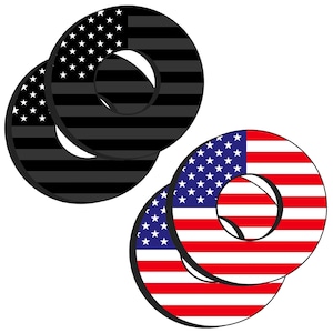 May include: Two sets of decorative rings with an American flag design. One set features a black and gray color scheme, while the other displays the classic red, white, and blue. Each ring has a circular shape with a hole in the center.