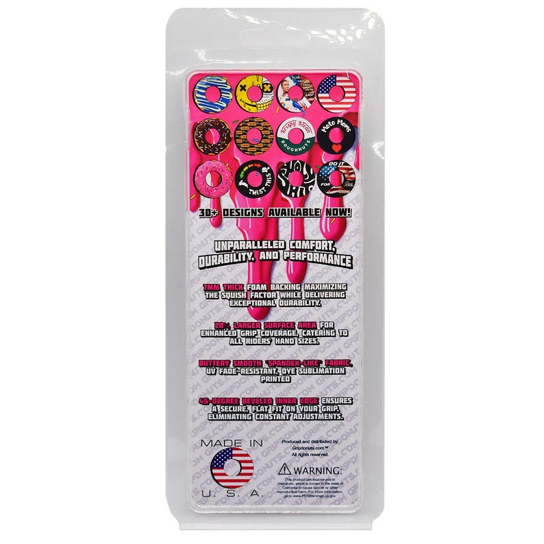 May include: A package of pink handlebar grips with various donut designs. The grips feature multiple colors and patterns, with text that reads "30+ designs available now!" and "Unparalleled comfort, durability, and performance."
