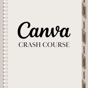 May include: A spiral-bound notebook with the title "Canva CRASH COURSE" in black lettering. The notebook has chapter tabs on the right side and the text "FOR FREE & PRO USERS" at the bottom. The background is a light beige with a marble-like texture.