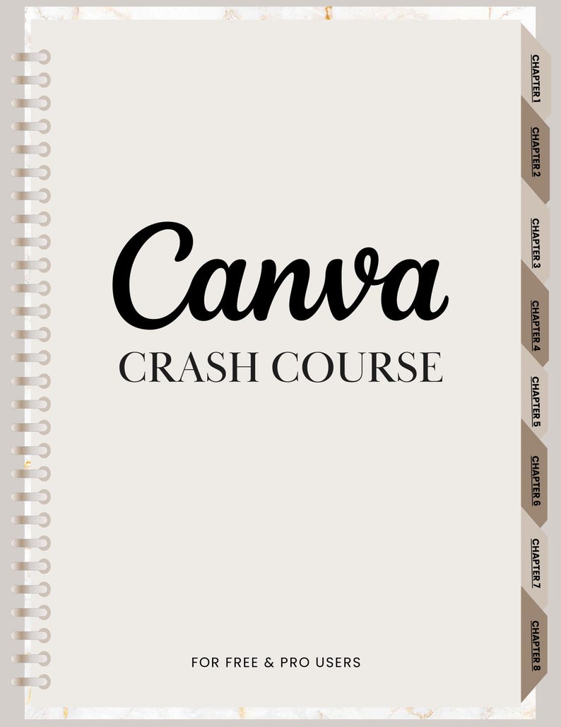 May include: A spiral-bound notebook with the title "Canva CRASH COURSE" in black lettering. The notebook has chapter tabs on the right side and the text "FOR FREE & PRO USERS" at the bottom. The background is a light beige with a marble-like texture.