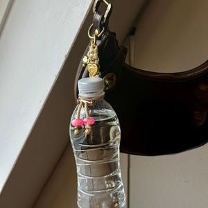 Gouden Boho Tashanger voor Waterfles - Festival Accessoire - Handgemaakte Sleutelhanger - Festival hack - Waterfles houder