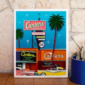 May include: A retro-style illustration of Canter's Deli in Los Angeles, California. The image features a bright blue sky with stars, palm trees, and two vintage cars parked in front of the restaurant. The sign reads "Canter's Fairfax" and "Open All Night".