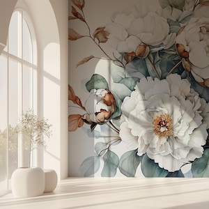 Puede incluir: Un mural de pared que presenta grandes flores de peonía blancas con centros de color amarillo suave, acentuadas por hojas de color verde apagado y tallos de color marrón anaranjado. El diseño floral se muestra sobre una superficie vertical plana.