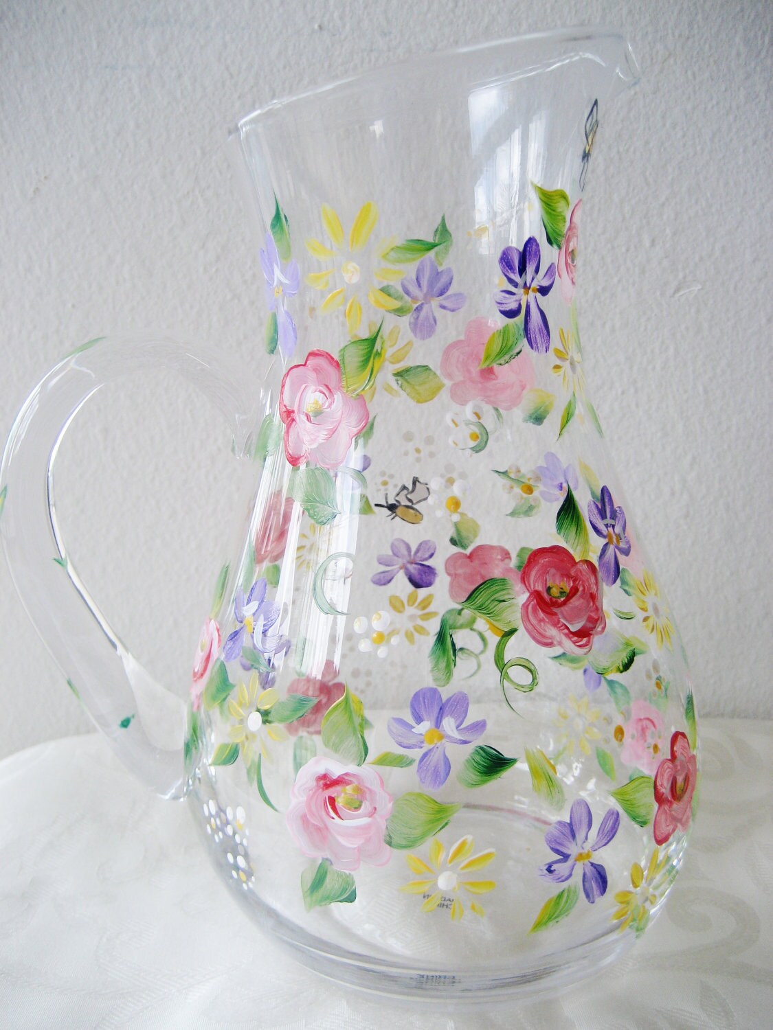 Pitcher or jug painted with flowers roses and