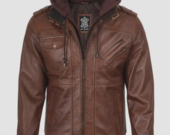 May include: Brown leather jacket with a detachable hood. The jacket features a zip-up front, multiple pockets, and ribbed cuffs and hem. The hood is a darker brown color, and the jacket has a bomber style.