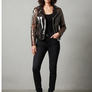 May include: A transparent black motorcycle jacket with a classic design, worn over a black top and paired with black jeans and boots. The jacket features a notched collar, zipper details, and a fitted silhouette.