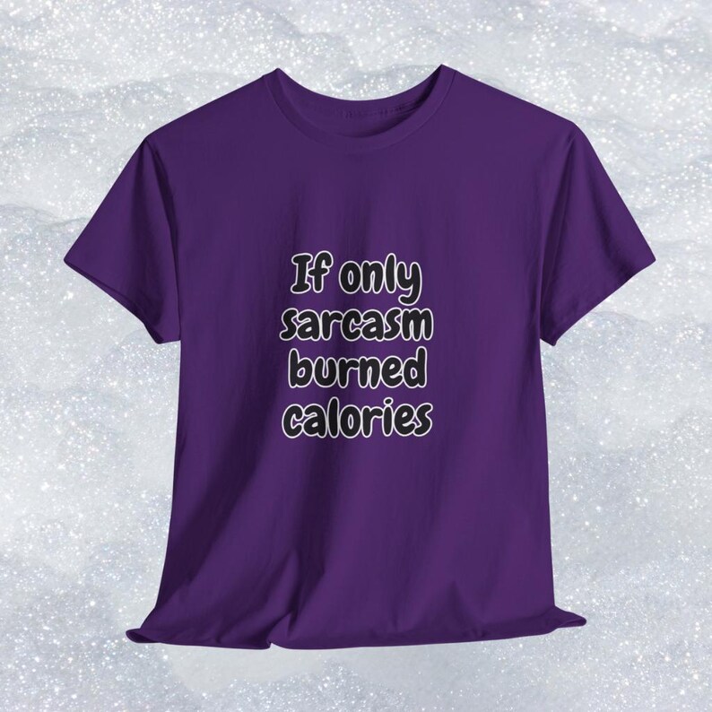 Someone modeling a comfortable short-sleeve shirt with a relatable and funny fitness quote. The bold text reads "If only sarcasm burned calories". This funny gym t-shirt for fitness lovers is a brilliant option for a humorous workout shirt or everyday casual wear.