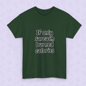 A relaxed, casual lifestyle shot of an individual wearing a relatable graphic top. The bold text highlights the phrase "If only sarcasm burned calories". Excellent as a humorous workout shirt, a funny gym t-shirt for fitness lovers, and comfortable everyday apparel for resting days.