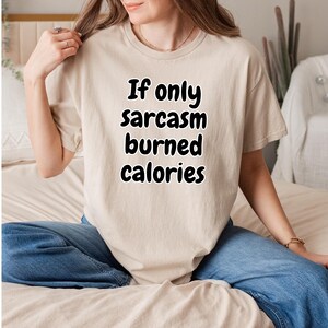 Detailed shot of a witty graphic shirt showing the phrase "If only sarcasm burned calories" in bold black lettering. A top choice for an if only sarcasm burned calories tee and a fun gift for gym rats and sarcastic friends who enjoy casual gym humor.