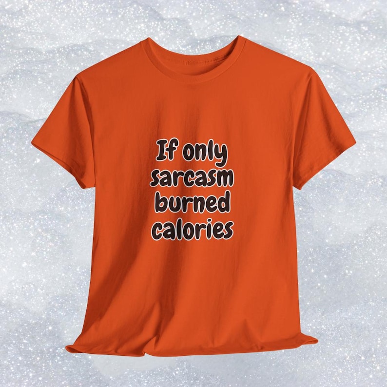 Focus on the humorous typography on an inclusive graphic t-shirt. It displays the quote "If only sarcasm burned calories" in a relaxed, bubbly font. This inspiring and funny clothing is a top-performing target for a gift for gym rats and sarcastic friends.