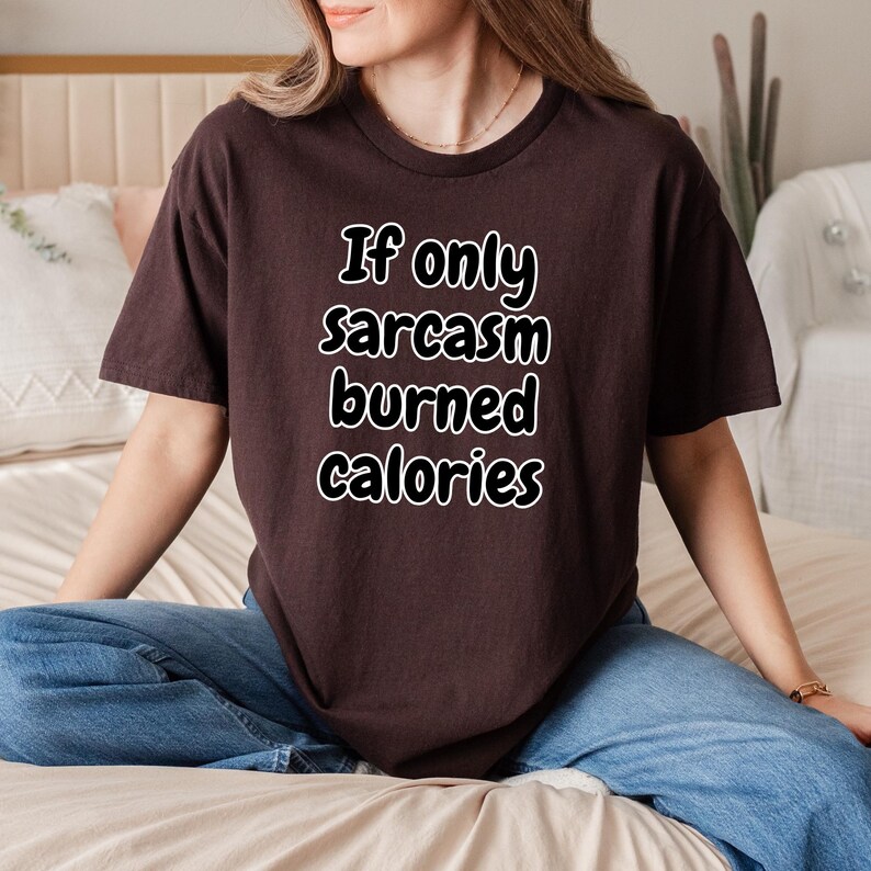 Front view of a premium quality graphic tee displaying the witty text "If only sarcasm burned calories". This relatable apparel piece is an amazing gift for gym rats and sarcastic friends, functioning perfectly as a humorous workout shirt for everyday activities.