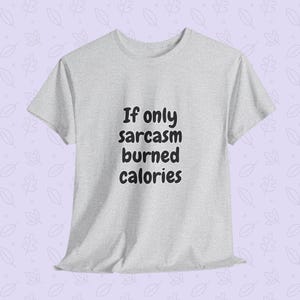 Lifestyle presentation of a person wearing a funny fitness quote tee reading "If only sarcasm burned calories" in a playful, rounded font. This humorous workout shirt serves as an excellent funny gym t-shirt for fitness lovers looking to showcase their personality at the gym.