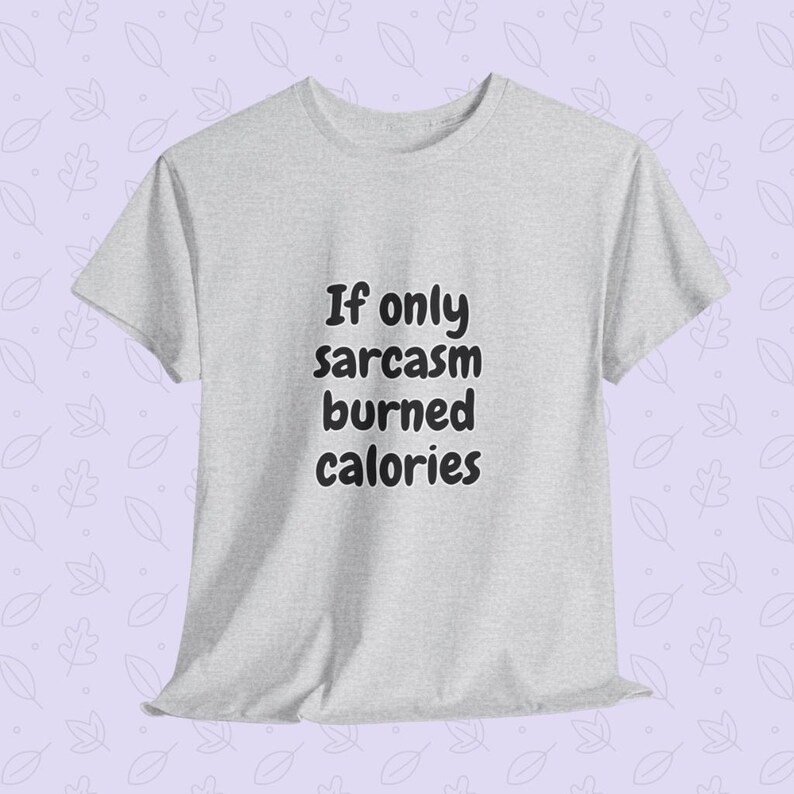 Lifestyle presentation of a person wearing a funny fitness quote tee reading "If only sarcasm burned calories" in a playful, rounded font. This humorous workout shirt serves as an excellent funny gym t-shirt for fitness lovers looking to showcase their personality at the gym.