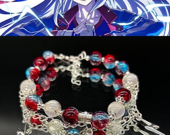 May include: A multi-strand bracelet featuring red, blue, and clear glass beads interspersed with silver-toned metal chains. The design includes dangling silver lightning bolt charms and a single prominent blue bead hanging from the center.