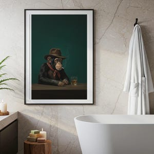 May include: Framed art print featuring a chimpanzee in a brown cowboy hat, red neckerchief, and smoking a cigarette. The chimp is seated at a table with a glass of amber liquid. The background is a dark teal color.
