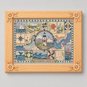 May include: A framed cross-stitch sampler titled Coastal Route featuring a central lighthouse surrounded by nautical motifs including a sailboat, compass rose, whale tail, waves, and seashells, all enclosed in a light wood frame with floral corners.