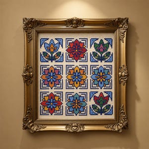 May include: A framed cross-stitch artwork featuring nine colorful floral patterns in a grid. The flowers are in shades of red, blue, orange, and green, set against a cream background. The ornate gold frame adds a vintage touch to the piece.