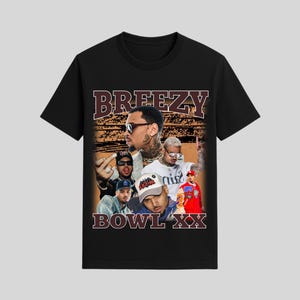 May include: Black t-shirt featuring a collage of images with the text "BREEZY" above and "BOWL XX" below. The images include a man with tattoos, sunglasses, and various poses. The shirt has a vintage, retro style.