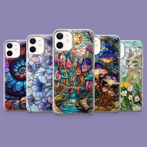 May include: Five phone cases with vibrant stained-glass artwork. The designs include a spiral, floral patterns, a village, mushrooms, and a cat. The cases are set against a purple backdrop.