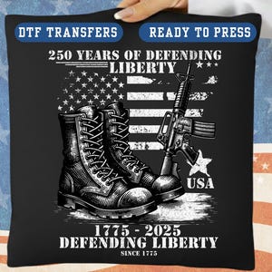 May include: Black graphic design featuring combat boots, a rifle, and the American flag. Text includes "250 Years of Defending Liberty" and "1775-2025 Defending Liberty Since 1775". The design is for DTF transfers, ready to press.