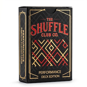 May include: Black playing card box with gold and red accents. The box features the text "THE SHUFFLE CLUB CO." in red, with "PERFORMANCE DECK EDITION" below. The side of the box reads "PERFORMANCE PREMIUM PLAYING CARDS".