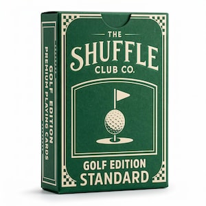 May include: A green playing card box with the text "THE SHUFFLE CLUB CO." and "GOLF EDITION STANDARD." The box features a golf ball with a flag on the front. The side of the box reads "GOLF EDITION PREMIUM PLAYING CARDS."