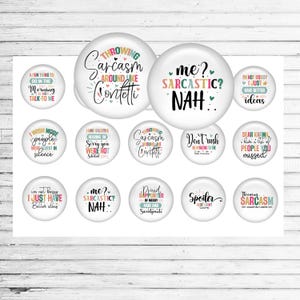 May include: A collection of white, round buttons with humorous phrases in various fonts and colors. Phrases include "Throwing Sarcasm Around Like Confetti," "Me? Sarcastic? Nah," and "I'm not bossy, I just have better ideas."