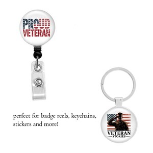 May include: A badge reel and a keychain. The badge reel has the text "PROUD VETERAN" in red, white, and blue. The keychain features a saluting soldier in front of an American flag with the text "VETERAN STORIES".