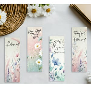 Set of four printable Christian bookmarks featuring soft pastel watercolor florals and inspirational faith quotes including Blessed, Dear God Thank You, Faith Hope Love, and Thankful and Blessed, arranged on a 2x6 inch print and cut sheet with matching PNG sublimation designs