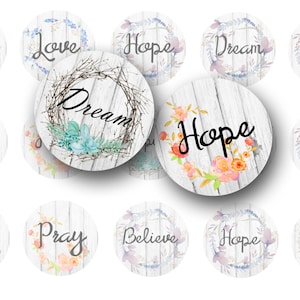 May include: A collection of round decorative items with inspirational words like "Dream," "Love," and "Hope." Each item features a floral or botanical wreath design. The background has a white, weathered wood texture.