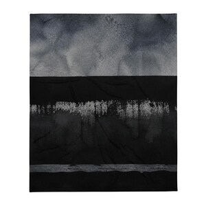May include: A rectangular throw blanket featuring a colour-blocked design. The top section is a mottled charcoal grey, followed by a solid black band, a textured silver-grey horizontal stripe, and a final solid black base at the bottom edge.
