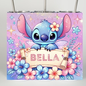 May include: A tumbler featuring a cartoon character with large ears, holding a banner that reads "BELLA". The design includes pink, blue, and purple flowers, stars, and a floral background.