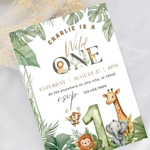 May include: A jungle-themed birthday invitation with the text "Charlie is a Wild One." The invitation features illustrations of a lion, giraffe, elephant, and monkey, along with tropical leaves and the number "1."