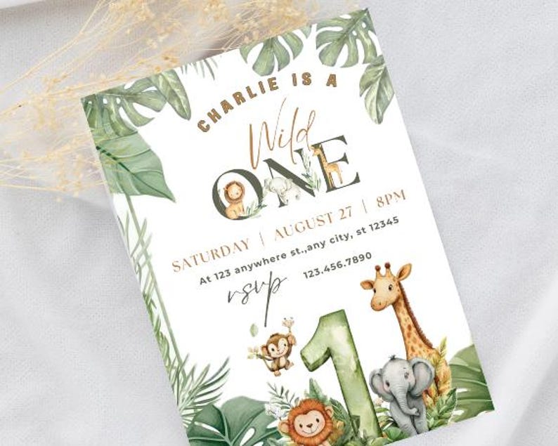 May include: A jungle-themed birthday invitation with the text "Charlie is a Wild One." The invitation features illustrations of a lion, giraffe, elephant, and monkey, along with tropical leaves and the number "1."