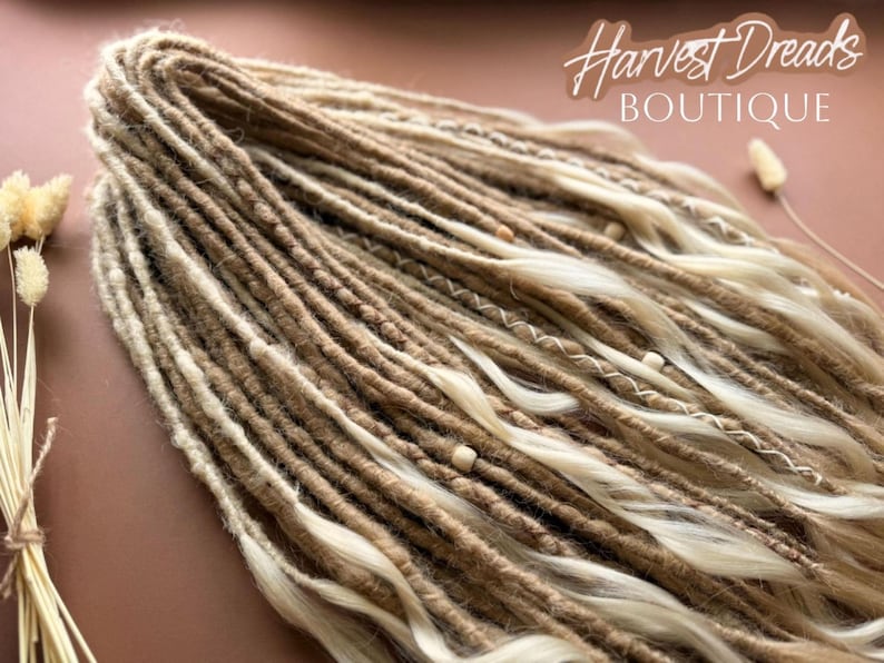a close-up view of a bundle of braided hair, with the text "Harvest Dreads Boutique" written above it.