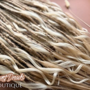 a close-up view of a collection of braided hair strands, with a focus on the intricate details and textures of the braids.