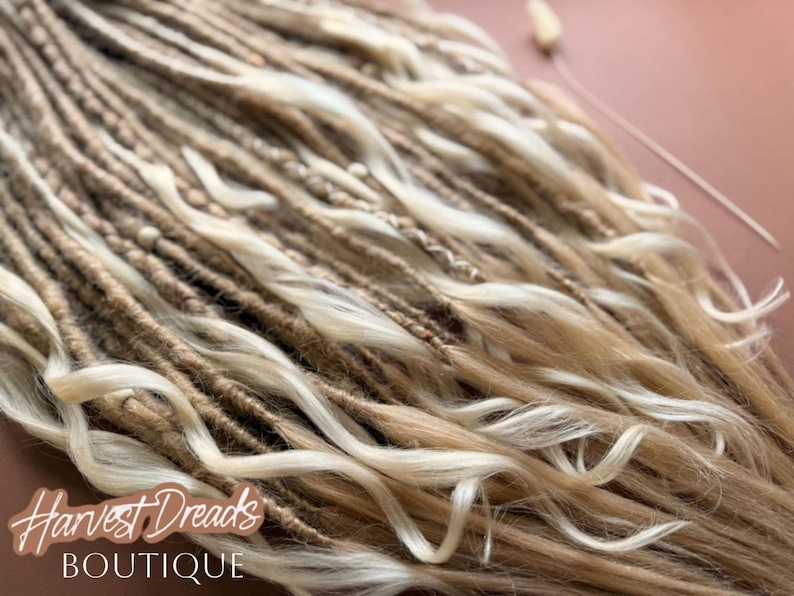 a close-up view of a collection of braided hair strands, with a focus on the intricate details and textures of the braids.