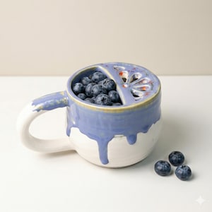 May include: A white ceramic mug with a black handle and the text "But First, Coffee" in a black, bold font. The mug is sitting on a wooden surface. The mug is approximately 4 inches tall.