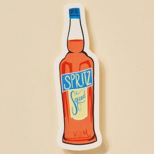 May include: A sticker of an orange bottle with a blue cap and a white label that says "SPRITZ Squad YUM".