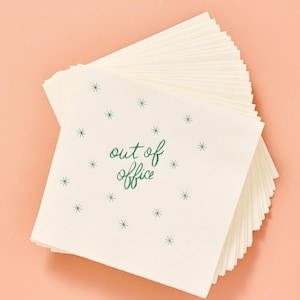 May include: A stack of off-white paper napkins with the words "out of office" in green script, surrounded by small green starbursts. The napkins are fanned out against a light pink background.