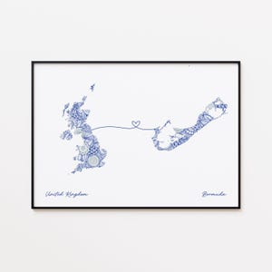 May include: A framed print featuring a blue and white patterned map of the United Kingdom and Bermuda, connected by a heart-shaped line. The words "United Kingdom" and "Bermuda" are written below the maps.