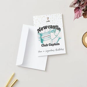 May include: A white greeting card with a matching envelope. The card features the text "Newcastle Club Captain" with a soccer-themed graphic. The card also includes the phrase "Have a Legendary Birthday!" and space for a name.