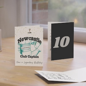 May include: A birthday card with a Newcastle soccer theme. The card features the text "Newcastle Club Captain" with a soccer ball graphic. The card also has the text "Have a Legendary Birthday!" and a space for a name.