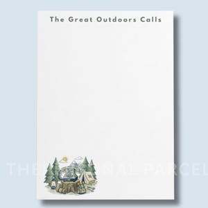 May include: A white notepad featuring the text The Great Outdoors Calls at the top. The bottom left corner displays a watercolor illustration of a rotary telephone on a tree stump, a tent, a lantern, and pine trees under a small yellow sun.